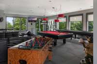 2nd floor of pool house features game room, perfect spot for home gym.
