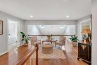The second floor landing overlooks the light-filled, main floor living room.