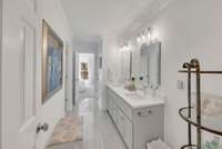 The updated Jack & Jill bathroom, with quartz double vanities, is shared with bedrooms 3 and 4