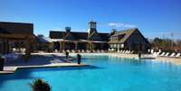 RESORT style LIVING!   Such an Amazing ZERO Entry POOL!                  RESIDENTS ENJOY                 1,500 sf fitness center                5,000 sf of party and meeting rooms                AstroTurf wiffleball field