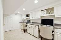 Perfect for a craft room or 2nd office this space offers ample cabinets & work space