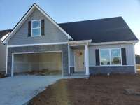 New Craftsman Style Home with Board & Batten Siding and Decorative Stacked Stone.   This is a Picture of a Previous Similar Home.
