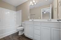 Custom Cabinets and Double Sinks in Primary Bath.