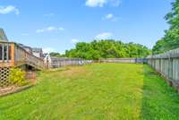 Large backyard with privacy fence