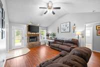 Large living room with fireplace and vaulted ceilings