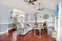 Living room is large enough for all of your family gatherings and offers extra storage/accent wall and vaulted ceiling