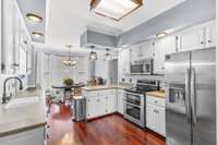 Kitchen has plenty of cabinets and counter space for the cook in the family. Breakfast nook in the bay window has room for a large table