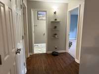 hallway to bedrooms, newer samsung washer & dryer in hall closet to the left. washer & dryer convey with home