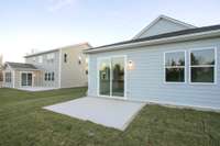 BACK EXTERIOR ON LEVEL LOT