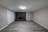 Downstairs bonus room, with storage and gas fireplace