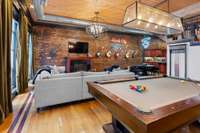 Massive living space has plenty of room for the pool table!