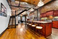 Plenty of bar seating in the kitchen for hosting large gatherings, or take the party up the stairs to the rooftop terrace.