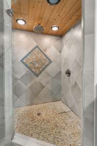 Spa-like walk-in tile shower with rain shower head