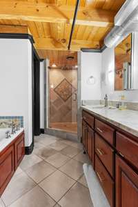 Master bathroom has everything you need: jetted tub, walk-in shower, dual vanities, and is home to the laundry room