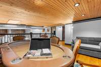 The poker table sits in the rec room upstairs and is ready for a chill evening in with friends. A pull-out sofa sits in the corner for those who "cash-out" early.