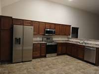 Kitchen has an abundance of Cabinets.