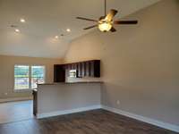 Living Room and Kitchen/ Dining Area has a Vaulted Ceiling.