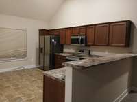 Another View of the Spacious Kitchen and Dining Area .