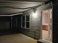Retractable Awning covers the entire Back Patio.