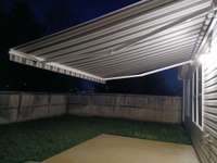 Upgraded Awning has remote control for easy opening and closing.