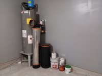 Water Heater and Upgraded Water Treatment System in the Garage.