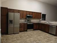 Stainless Refrigerator with Water and Ice in the Door.