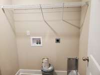 Separate Laundry Room is located next to the Garage.