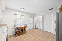 Eat-in kitchen with access to the patio.  Laundry are and pantry are easily accessible in the kitchen area