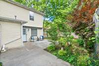 Large patio with outdoor storage area
