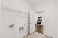 Extra large Mud Room-entry from the garage into the kitchen. Washer dryer connection and shelf.