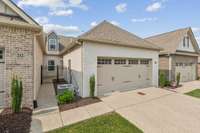 Courtyard patio and two car garage. Patio entry and garage entry.