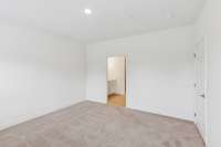 Primary suite will accommodate a king bed ,two night stands, and a dresser or chest of drawers.