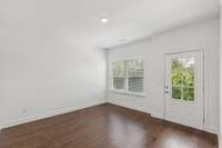 Flex Room/Sitting space or make this an office. Hardwood floors, treeline view. Huge coat/storage closet next to this room.