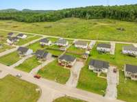 This home is the one with the red car in the front! Notice the hilly & bluff views!