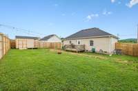 A look at the back yard from the corner of the fenced yard.