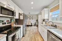 Looking from the Laundry toward the Kitchen & Dining areas.