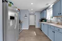 Laundry space at the end of the kitchen next to the garage door