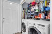 Laundry space next to garage door