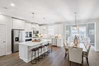 Chef's kitchen, dining. and morning room shown. Optional covered porch available as well.