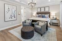Oversized Primary suite downstairs with tray ceiling and private on-suite bathroom.