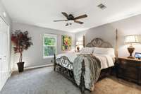 primary bedroom with all new windows and carpet and brand new fan