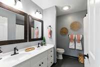 updated bathroom with dual vanity