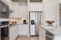 All interior photos are of a model home in another community.  Interior and exterior colors and features will be different.