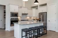 All interior photos are of a model home in another community.  Interior and exterior colors and features will be different.