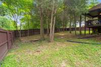 Big backyard with storage area under the deck.