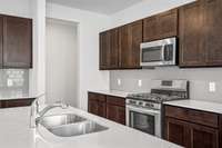 The Grayson A: This photo is of a completed home. NOT the subject property