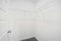 Closet 2 of 2 in Primary Bedroom: Photo is of a completed home; not the subject property.