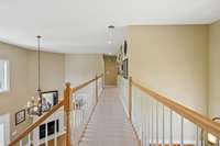 The upstairs hallway features elegant railing and leads seamlessly to the remaining bedrooms, creating an open yet connected feel throughout the upper level. 2640 Chesterfield Ct. Murfreesboro, TN 37129
