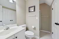 The bathroom is spacious and well-appointed, featuring a large mirror, ample counter space, and stylish hanging fixtures for added convenience. 2640 Chesterfield Ct. Murfreesboro, TN 37129
