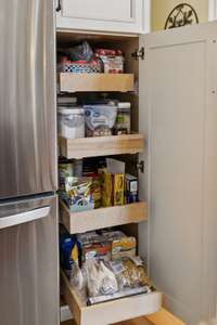 Tucked beside the fridge, a secret cabinet reveals slide-out wooden drawers, offering hidden, extra storage that’s both clever and convenient. 2640 Chesterfield Ct. Murfreesboro, TN 37129